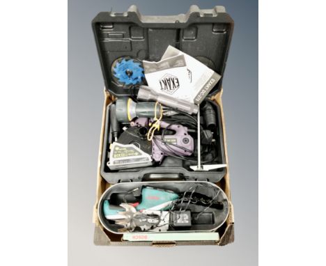 A box of tools including Bosch handheld hedge trimmer, circular saw, hand torches. 