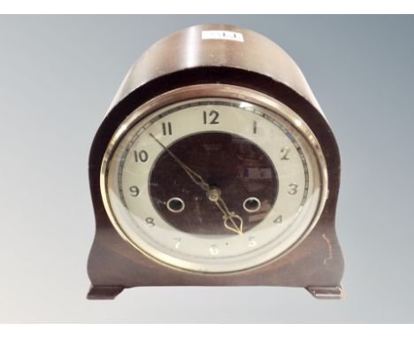 An oak cased mantel clock. 