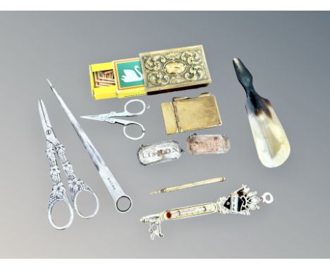 A decorative brass vesta case, silver-plated meat skewer and scissors, brass note book, decorative brass key thermometer, sho