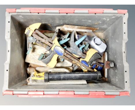 A plastic crate of assorted tools and hardware, drill bits, planers etc. 