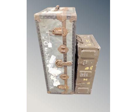 A vintage metal bound shipping trunk and an ammunition crate 