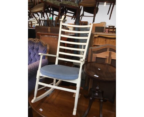 A retro white painted ladder back rocking chair 