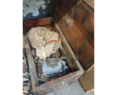 A wooden toolbox with various vintage tools 