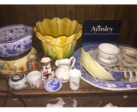 Shelf of pottery inc. blue and white platter and majolica style jardiniere 