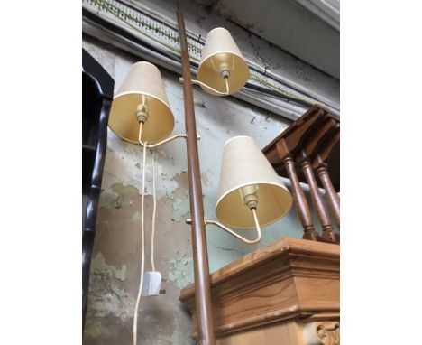 A retro floor to ceiling standard lamp. 