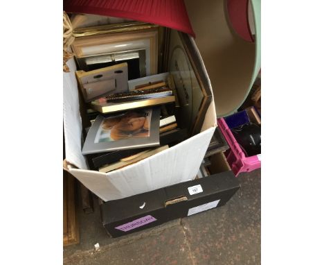 A box of picture frames and 3 lamp shades 