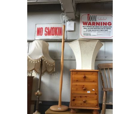 A light wood standard lamp 