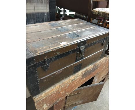 A metal and wood bound trunk 