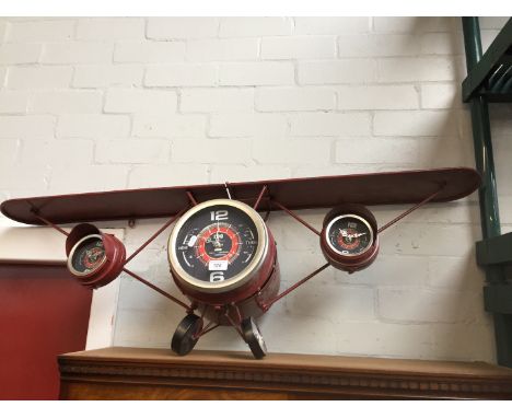 A shelf/clock in the form of a plane 