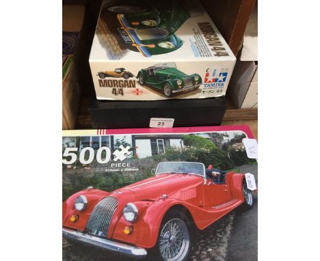 2 Morgan car jigsaws and a watch display case 