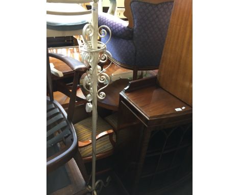 A wrought metal standard lamp 