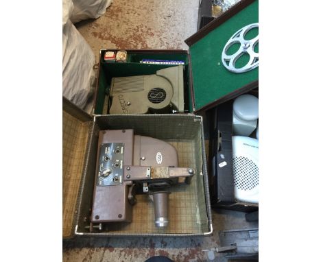 Two leather cases containing a slide projector and a cine projector 