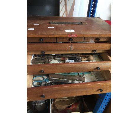 A 5 drawer cabinet containing small tools 