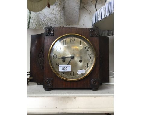 An oak mantle clock. 