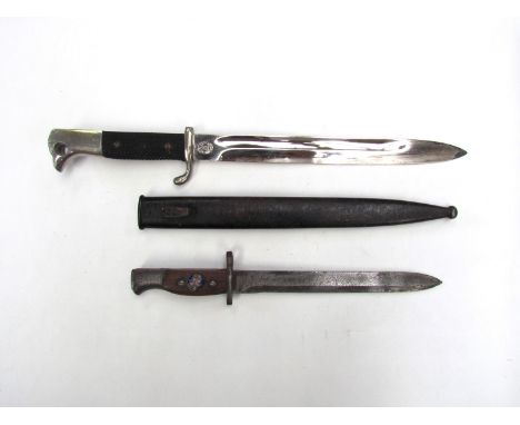 A Third Reich era German Police dagger by Eu. F. Horster with scabbard, together with a Belgian bayonet (2) 