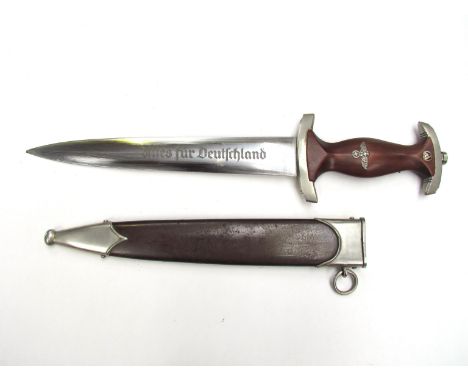 A German design SA dagger by Tiger, Solingen. The hardwood grip set with inset eagle and swastika, with roundel to end, twin 