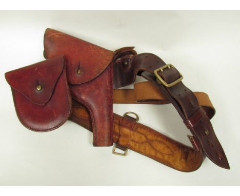 A Sam Browne leather belt with Webley pistol holster, ammunition pouch and shoulder strap
