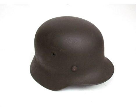 A WWII German M40 helmet with associated liner