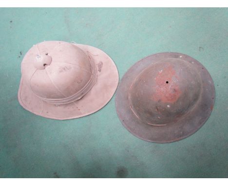 A British military pith helmet and a WWII Civil Defense helmet (2)