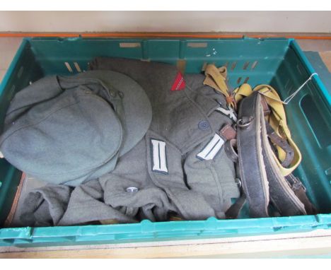 A box of German equipment including backpack, army blouse, Y straps and hat etc