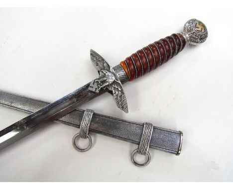 A German design second pattern Luftwaffe dagger bearing SMF Solingen mark, with scabbard. Buyer to determine age.