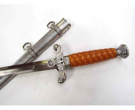 A German design Army dagger with scabbard. Buyer to determine age.