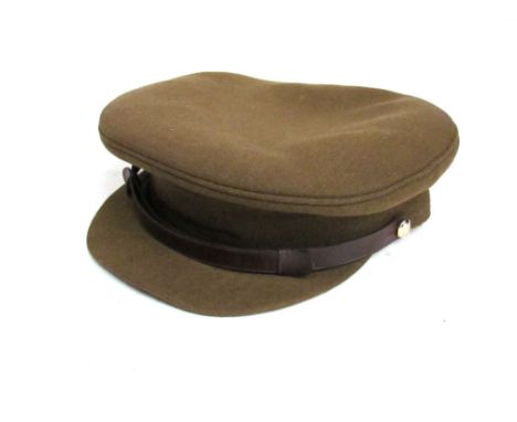 A mid 20th Century British Army officer's peaked cap together with later example, with box. Previously belonged to JOHN STENS