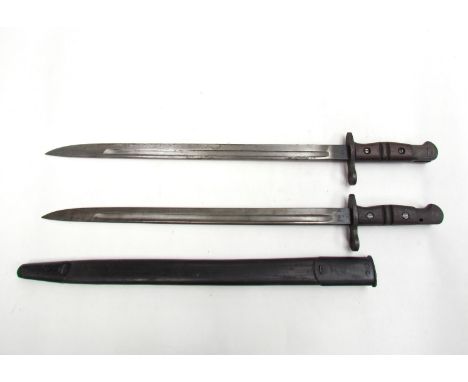 A US M1917 bayonet with scabbard, together with a British 1913 (P13) pattern bayonet dated 7 17 to blade, both with later gri