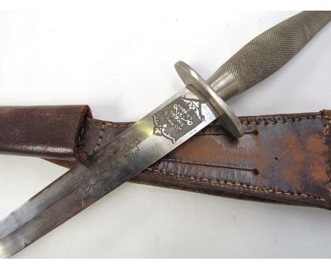 A Fairbairn-Sykes first pattern fighting knife marked "The F-S Fighting Knife" and "Wilkinson Sword Co. Ltd, London". Chequer