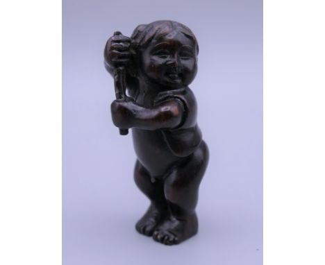 A 19th century netsuke formed as a boy.  5 cm high.