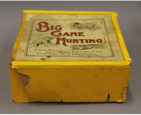 A vintage boxed Big Game Hunting mechanical toy. The box 20 cm wide.