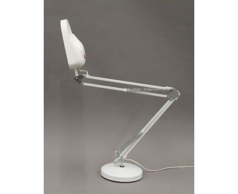 An angle poise magnifying lamp.