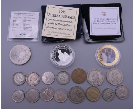 A small quantity of Commemorative coins and a fork.  Fork 27 cm long.