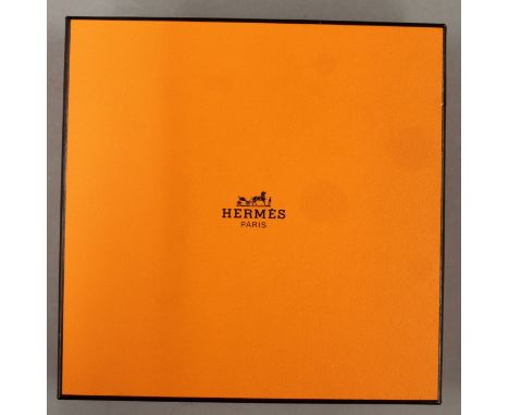A boxed Hermes scarf.