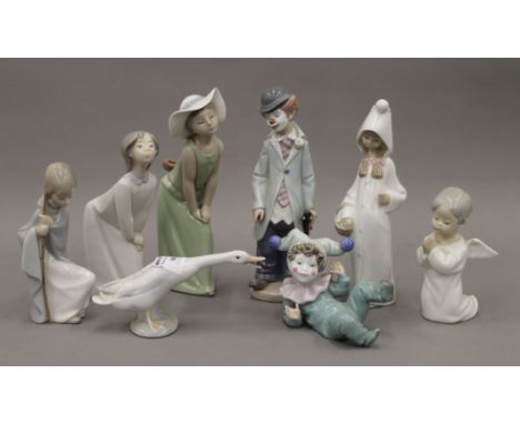 A quantity of Lladro and Nao porcelain. The largest 22 cm high.
