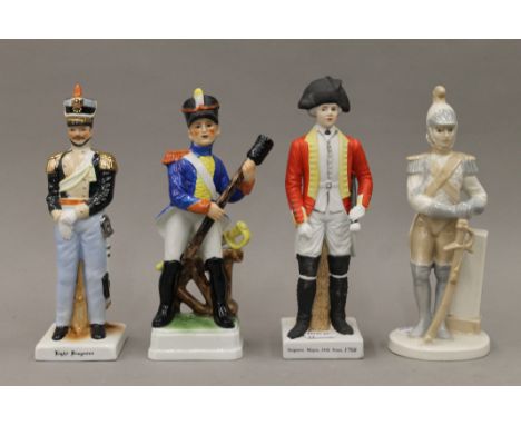 Four ceramic soldiers. The largest 22 cm high.