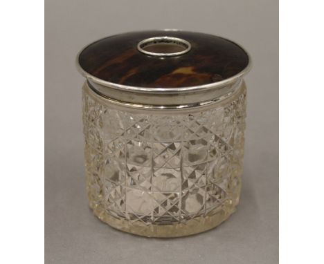 A cut glass, silver and tortoiseshell hair tidy, hallmarked for London 1917; together with a hair comb. The former 7.5 cm hig