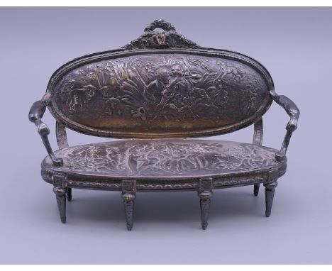 A Dutch silver miniature sofa.  11 cm wide x 7.5 cm high x 4 cm deep. 109.2 grammes.