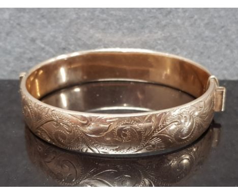 9CT GOLD ON SILVER BANGLE MARKED 1/5 9CT, AG AND MAKER R AND W PROBABLY RIGBY AND WILSON FERN ETCHED TO ONE SIDE, 65MM X 60MM