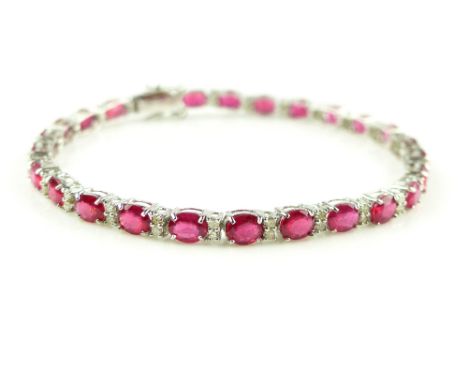 18ct white gold, ruby and diamond tennis / link bracelet, rubies 11.58ct, diamonds 0.97ct