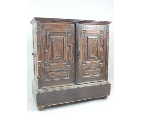 18th century continental oak vargueno cabinet, the pair of panel doors with applied and split moulding opening to reveal an a