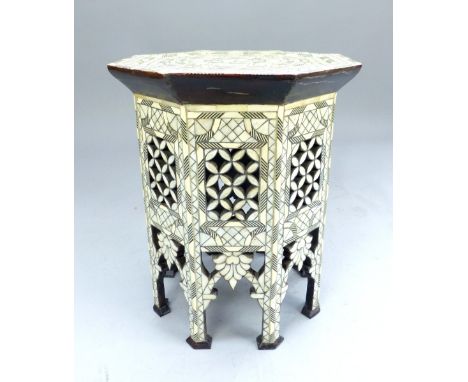 Moroccan side table of hexagonal form, mother of pearl & bone with metal filling, period side panels and niche feet. 51x 41 c