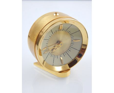 A Jaeger LeCoultre bedside alarm, the cream dial set out with batons at quarter hours. H. 5cm