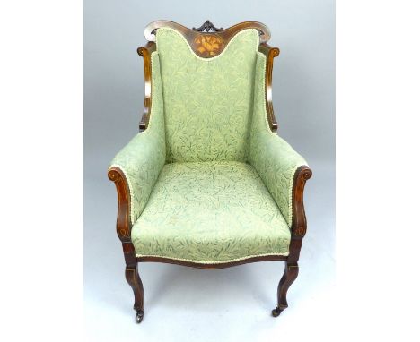 Edwardian wingback chair, mahogany with marquetry panel of musical instruments, floral carving, scroll inlay, bowfront seat.