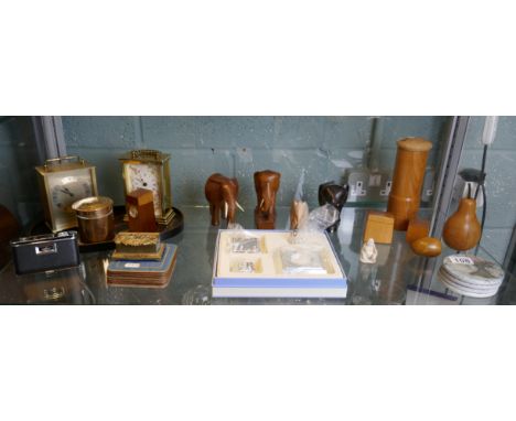 Shelf of collectables to include carriage clocks and treen