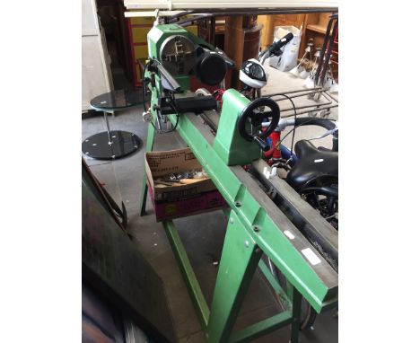 A NU-TOOL NWL900 VARI SPEED WOOD LATHE AND A BOX OF CHISELS ETC