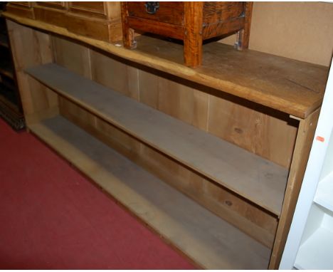 An extremely long elm bar, the top of naturalistic outline, with single rear shelf, length 245cm