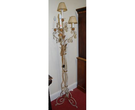 A painted wirework four light standard lamp of scroll form having cut crystal droplets