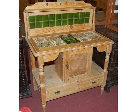 A late Victorian pine round cornered and tile-inset washstand, having single cupboard over single long lower drawer, w.88cm