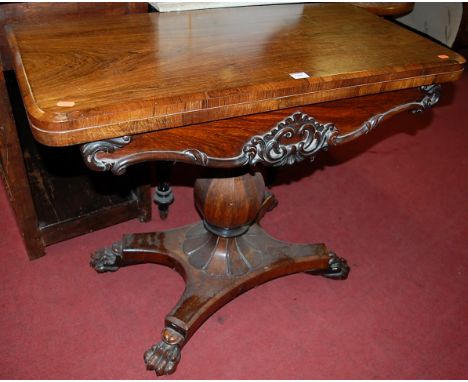 An early Victorian rosewood round cornered fold-over card table, having a revolving action with floral moulded shaped frieze 